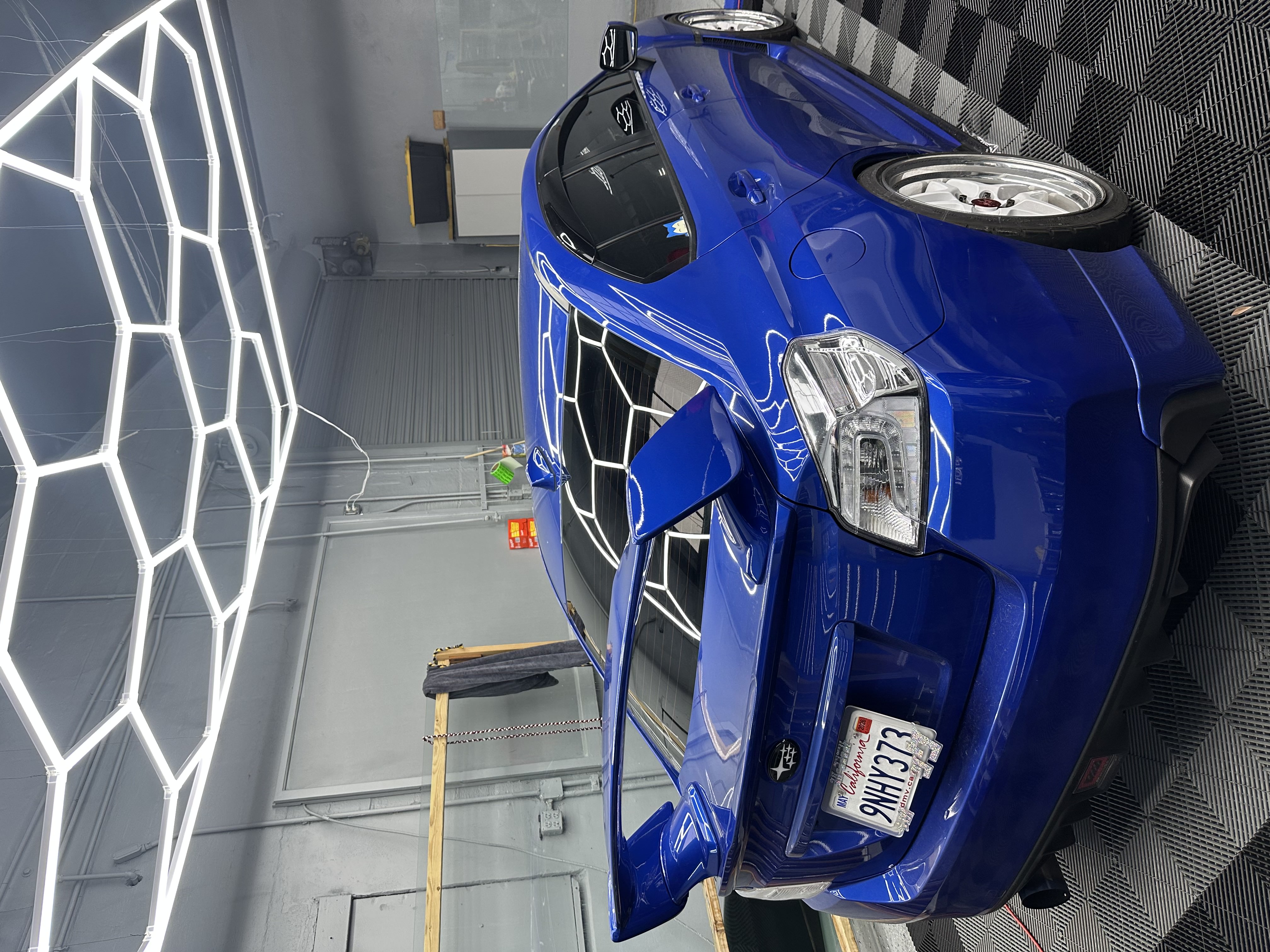 White performance sedan front view